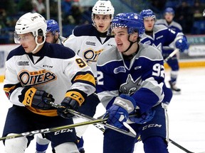Blake Murray, right, of the Sudbury Wolves, and Troy Lajeunesse, of the Erie Otters, battle for position during OHL action at the Sudbury Community Arena in Sudbury, Ont. on Friday February 2, 2018. John Lappa/Sudbury Star/Postmedia Network