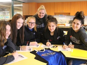 Girls of the Bluewater Storm register for the upcoming fastball season. From left are Taylor Bernard, Jessica Dunlop, Ryleigh Keefe-DeBie, Skye McLean and Kaitlyn Medieiros. Standing behind the girls is one of the Storm coaches, Carley Keefe. (NEIL BOWEN/Sarnia Observer)