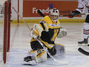 Kingston Frontenacs goalie Jeremy Helvig watches as a shot goes whistling past the post during the first period of Ontario Hockey League action at the Rogers K-Rock Centre in Kingston, Ont. on Saturday February 3, 2018. Helvig was named the first star of the game as the Frontenacs defeated the Ice Dogs 5-3. Steph Crosier/The Whig-Standard/Postmedia Network