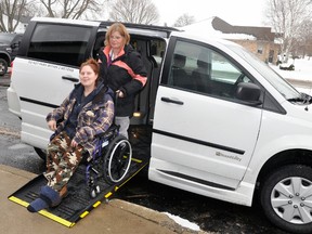 Driver Sunsan Kunkel assists Patty Van Horn out of the 2017 Mitchell & Area Community Outreach van, a Dodge Grand Caravan SE, that is now in operation, replacing their seven-year-old van. Van Horn had an appointment at the Mitchell Family Doctors and says the new vehicle is a nice upgrade. ANDY BADER/MITCHELL ADVOCATE