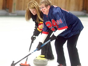 Suzy and Janice Gurd team up to sweep at the Chatham-Kent Health Alliance Foundation's Charity Curling Classic held on Saturday at the Sydenham Community Curling Club. The event had an Olympic theme and raised money for the CKHA Diagnostic Imaging Equipment Renewal Campaign.