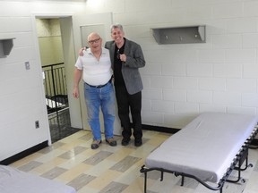 Rev. Edward Murray, right, and retired fire chief James Grant in one of the classrooms converted into a dorm. (Wayne Lowrie/Postmedia Network)
