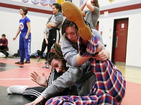 Tyanna Soucy of the Marymount Academy Regals wrestling team trains with Sudbury Regional Wrestling Club coach Patrick Quenville in Sudbury on Monday. Soucy will be competing in the 83-kg categorey at today's high school city championships. Gino Donato/Sudbury Star/Postmedia Network