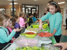 St. Anne Catholic School students get a healthy serving of fruits and veggies for lunch as part of the Healthy Kids Community Challenge initiative on Feb. 1.
CARL HNATYSHYN/SARNIA THIS WEEK