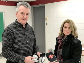 Jim Keane, principal at Lambton Kent Composite School in Dresden, and Rhonda Lystra, principal of North Lambton Secondary School in Forest, were among high school administrators who participated in a Feb. 1 training session on how to use naloxone kits. The Lambton Kent District School Board is following the lead of several over Ontario school boards to place the kits in schools and have staff trained to use them if a student has an opioid overdose. 
Handout/Postmedia Network