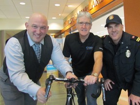 Ready for this year's Bluewater International Granfondo are, from left, organizing committee members Jonathan Palumbo and Kenneth MacAlpine, and Sarnia firefighter Mike Otis. This year's cycling event, set for Aug. 5 at Mike Weir Park, will include the Ontario First Responder Road Cycling Championships. (Paul Morden/Sarnia Observer)
