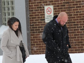 Lawyer Jennesa Plaine and Const. Wesley Reeves leave London police headquarters after a Police Services Act hearing on Thursday Nov. 14, 2017. (DALE CARRUTHERS, The London Free Press)