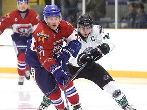 Kyle Liinamaa of the Rayside Balfour Canadians and Nick Long of the Elliot Lake Wildcats battle for the puck during NOJHL action in Sudbury, Ont. on Thursday September 7, 2017. Gino Donato/Sudbury Star/Postmedia Network