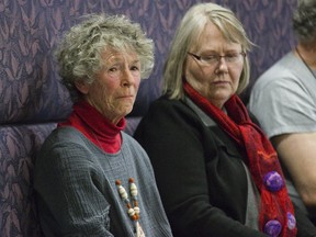 Nan Finlayson sits with her longtime friend Jacqui Shields in the public gallery of the council chambers where she learned that she will likely lose her battle to keep her home at 100 Stanley St. when council votes on the matter next week. (DEREK RUTTAN, The London Free Press)