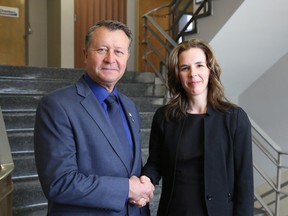 Above, Huron County Warden Jim Ginn congratulates Meighan Wark on Wednesday after she was named the county's new CAO. Wark has been with the county for 11 years and served as acting CAO for the last six months.