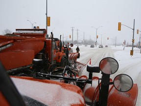 Three city snowplows line up to clear Taylor-Kidd Boulevard in Kingston, Ont. on Wednesday, Feb. 7, 2018. 
Elliot Ferguson/The Whig-Standard/Postmedia Network