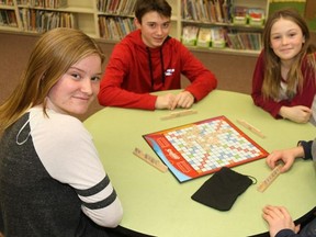 TIM MEEKS/THE INTELLIGENCER
Jessica Downer, Cooper Matthews, Jenna Downer and Jared Matthews play Scrabble to promote Global School Play Day to be held Monday from 11:40 a.m. to 1:20 p.m. at Park Dale Public School. The event, designed to get children to turn off technology and restore unstructured play to a generation of kids, was originally scheduled for Wednesday, but bad weather forced its postponement.