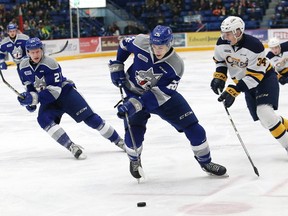 Anthony Tabak, middle, of the Sudbury Wolves, attempts to evade Jack Duff, of the Erie Otters, during OHL action at the Sudbury Community Arena in Sudbury, Ont. on Friday February 2, 2018. John Lappa/Sudbury Star/Postmedia Network