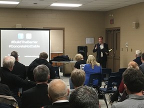 MPP Jeff Yurek (Elgin-Middlesex-London) speaks to a crowd at a town hall meeting in Lambeth on Wednesday night. The meeting centred around the timeline for installing concrete median barriers on a stretch of Highway 401 between London and Tilbury. The province announced on Monday it would build those barriers after a renewed environmental assessment. (MEGAN STACEY, The London Free Press)