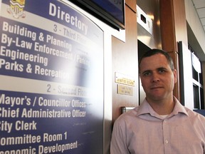 Dale Mosley, accessibility coordinator with the City of Sarnia, stands by a building directory at city hall featuring braille. A recent investigation found city hall is accessible for people with sight impairments. Tyler Kula/Sarnia Observer/Postmedia Network