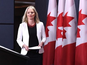 Minister of Environment and Climate Change Catherine McKenna arrives for a press conference on the government's environmental and regulatory reviews related to major projects, in the National Press Theatre in Ottawa on Thursday, Feb. 8, 2018. THE CANADIAN PRESS/Justin Tang