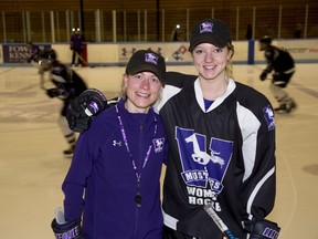 Western Mustangs coach Kelly Paton and player Emma Pearson during practice at Thompson Arena. (DEREK RUTTAN, The London Free Press)