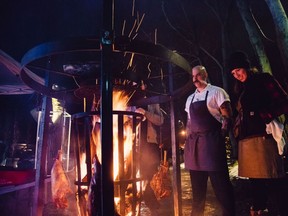 Rick O’Brien/SUpplied photo
Executive chef Alexandra Feswick cooks legs of lamb suspended from an iron wheel wrapped around a huge vertical fire pit that stands five feet high.