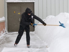 BRUCE BELL/the intelligencer
Not all the snow in Prince Edward County is cleared by plows and blowers. Pictured is Essroc Arena attendant Sean Forestell keeping the walkways clear on Friday afternoon.