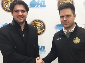 Defenceman Mitch Eliot, left, greets general manager Nick Sinclair after committing to the Sarnia Sting. (Photo courtesy of Sarnia Sting)