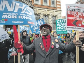 Demonstrators participate in a protest against the Conservative government?s health policy on Feb. 3 in London, England. (Chris J Ratcliffe/Getty Images)