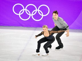 Michael Marinaro of Sarnia, Ont., and Kirsten Moore-Towers of St. Catharines, Ont., practise at Gangneung Ice Arena ahead of the pairs figure skating competition at the 2018 Winter Olympics in Pyeongchang, South Korea, on  Thursday, Feb. 8, 2018. (MLADEN ANTONOV/Getty Images)