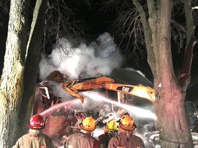 Firefighters with the Chatham-Kent Fire and Emergency Services are shown at the scene of a vacant farm house fire on Old Street Line in Blenheim which started Thursday evening. Handout/Postmedia Network