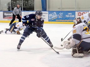 Photo by Russ Ullyot, Postmedia Network
Canmore Eagles’ Justin Giacomin takes a shot on goal during an AJHL game against the Spruce Grove Saints at the Canmore Recreation Centre on Friday.