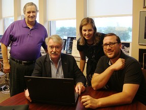 Handout/Sarnia Observer/Postmedia Network
Sarnia Historical Society members Phil Egan, left, Laura Greaves and Ron Reale Smith are pictured in this file photo with Sarnia Mayor Mike Bradley, centre. Reale Smith recently called for better access to city historical items in the collection at the Lambton Heritage Museum.