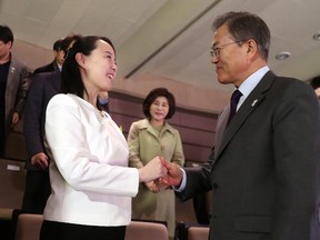 South Koran President Moon Jae-in, right shakes hands with Kim Yo Jong, North Korean leader Kim Jong Un's sister, after a performance of North Korea's Samjiyon Orchestra at National Theater in Seoul, South Korea, Sunday, Feb. 11, 2018. (Bee Jae-man/Yonhap via AP)