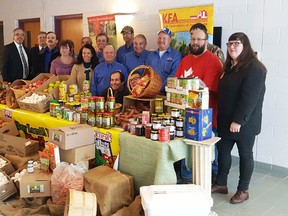 Donors and logal dignitaries met at the Chatham-Kent Salvation Army to present food collected in recognition of Food Freedom Day Feb. 9, 2018. Shown in the photo are Mayor Randy Hope, Captain Stephen Holland with the Salvation Army, Jim Adams with Adams Industrial, Brenda Leclair with Outreach for Hunger, Carol Verstraete with the Ontario Federation of Agriculture, Joe Vanek with the Grain Farmers of Ontario District 2, Mary Anne Udvari with the Kent Federation of Agriculture, Ken Dawson with the KFA, Louis Roesch from Roesch Meats & More, Chatham-Kent Coun. David VanDamme, Rob Chambers with RV Vegetables, Chatham-Kent agricultural specialist Kim Cooper, Harry Lawson with the KFA, Mike Vannieuwenhuyze with the KFA, Greg Glasier with GFO District 2, Matt Clark with Essex-Kent Junior Farmers and Meaghan McLean with the local Junior Farmers. (Handout)