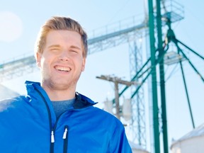 Matthew Vanheule, 19, stands in front of grain elevator legs currently operating as a makeshift wireless internet tower. With his company MPV Wifi, his goal is to bring affordable high-speed internet to rural Ontario with infrastructure already in place. (LOUIS PIN, Times-Journal)