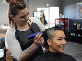 Creedence Rayne gets her head shaven at Curl Up and Dye Hair Salon on Feb. 5.
