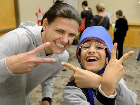 Taha Ghiassi,12, meets Canadian National Soccer Team captain Christine Sinclair during a reception for kids from the Thames Valley Children?s Centre part of the annual London Sports Celebrity dinner held at the London Convention Centre on Monday February 12, 2018. (MORRIS LAMONT/THE LONDON FREE PRESS)