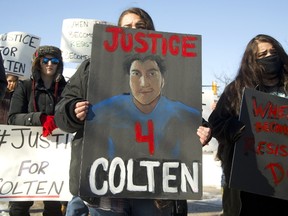 Jordan Mirasty, 16 and her twin sister Janeah of London protest the verdict in the shooting death of Colten Boushie of Saskatchewan. Over 100 protesters listened to speakers first at Victoria Park then walked on the roads with a police escort to the London court house on Monday February 12, 2018. (Mike Hensen/The London Free Press)