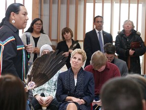 Premier Kathleen Wynne listens to traditional knowledge keeper Rob Spade at the Indigenous Sharing and Learning Circle at Laurentian University on Monday. Wynne visited Laurentian University and participated in a town hall discussion with students. Gino Donato/Sudbury Star/Postmedia Network