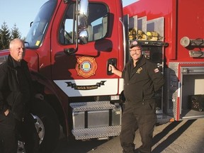 Above are Dave Erb (left) and Bluewater Fire Chief Dave Renner (right) standing by the Zurich tanker truck that was purchased by Bluewater last year.Renner expressed his concerns with the new fire regulations imposed by the Ontario government. (William Proulx/Exeter Lakeshore Times-Advance)