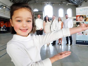 Luke Hendry/The Intelligencer
Lila Kelly, 6, helps organizes of the Hospice Quinte gala committee promote their event Tuesday at the Belleville Armouries. With her from background left are her father, Hospice Quinte staffer Michael Kelly, gala co-chairs Amber Clarke and Darek Wierzbicki, and committee members Lisa Lynch and Curt Flewelling. Guests are encouraged to wear white.