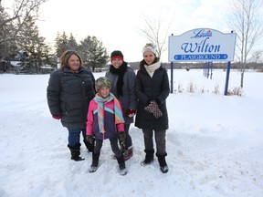 Meghan Balogh/The Whig-Standard
Jo-Anne Crook, Sandra Salt, Amanda Stewart, and Emilia Stewart (front) stand in front of the Wilton Playground that they hope will be new and improved by Canada Day of this year.