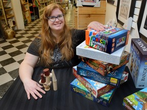 Kayla Gibbens, owner of Uber Cool Stuff, has more than 2,300 board games in stock at her store.  Participants at Saturday?s Family Game Day at Centennial Hall will have a chance to play any of the  games in the libraries of the event?s two sponsors ? L.A. Mood Comics and Games and Uber Cool Stuff. (MORRIS LAMONT, The London Free Press)