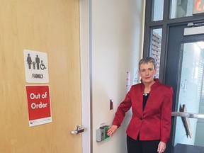 Chief executive Heather Robinson shows off the locks that have been placed on the washroom doors at the St. Thomas public library. The doors have had to be locked as people are using drugs in the washrooms. City hall across the street is having the same issue. (Laura Broadley/Times-Journal)