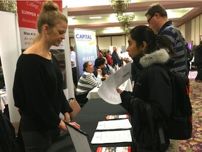 Amelia Campbell of St. Lawrence College Conference Services talks to Aswani Ashok about available summer positions, at the YGK Job Fair held Wednesday at the Ambassador Hotel. (Crystal Oag/For The Whig-Standard)
