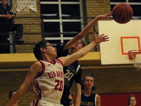 College Avenue Knights Nicholas Swan tips the ball away from Woodstock Collegiate Institute Red Devils Eric Boerschke in Woodstock, Ont. on Tuesday February 6, 2018 at WCI in their TVRA Southeast Division junior boys' basketball game. WCI will play in the 'A' final and CASS the 'AA' final and a chance to go to WOSSAA. Greg Colgan/Woodstock Sentinel-Review/Postmedia Network