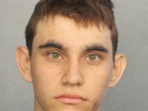 This photo provided by the Broward County Jail shows Nikolas Cruz. Authorities say Cruz, a former student opened fire at Marjory Stoneman Douglas High School in Parkland, Fla., Wednesday, Feb. 14, 2018, killing more than a dozen people and injuring several. (Broward County Jail via AP)