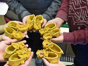 Grade 7 students at Little Current Public School have handcrafted 21 pairs of moccasins for babies in local First Nations communities. Supplied photo