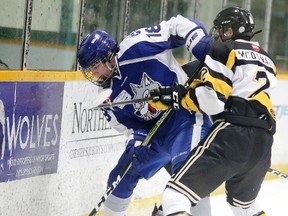 Brett McGlade of the Sudbury Nickel Capital Wolves battles for the puck with Kody McDonald of the New Liskeard Cubs during Great North Midget League action in Sudbury, Ont. on Sunday January 28, 2018. Sudbury defeated New Liskeard 6-2.Gino Donato/Sudbury Star/Postmedia Network