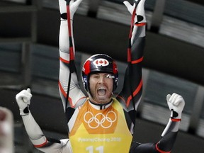 Canada?s Tristan Walker and Justin Snith ? half of a luge relay team that narrowly missed a medal at Sochi in 2014 ? exult after the same squad?s silver medal-winning run at the 2018 Winter Games in Pyeongchang, S. Korea, Thursday. (Andy Wong/The Associated Press)