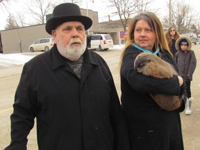 Weather predictions made by furry critters is a service available in Plympton-Wyoming but you can't buy a wedding licence there. Town councillors recently rejected a plan to begin issuing marriage licences at the municipal office. In this file photo, Plympton-Wyoming Mayor Lonny Napper stands with Peggy Jenkins, and Oil Springs Ollie, of Heaven's Wildlife Rescue during a Ground Hog Day ceremony earlier this month outside the Wyoming library. (Paul Morden/Sarnia Observer/Postmedia Network)