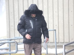 Claude Eric Trachy walks into the Chatham courthouse on Thursday, Feb. 14, 2018. The retired violin teacher faces numerous historic sexual charges involving his former students. (Trevor Terfloth/The Daily News)