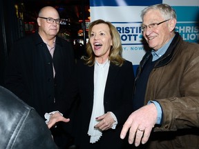 Ontario Progressive Conservative leadership candidate Christine Elliott talks with Oxford MPP Ernie Hardeman, right, a 23-year Queen?s Park veteran, and Rob Flack during a meeting Friday with area Conservatives at Joe Kool?s bar in London. (MORRIS LAMONT, The London Free Press)